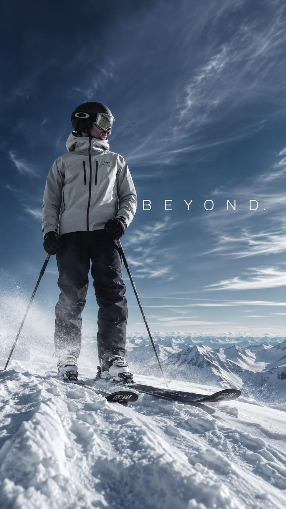 Lone skier standing on a snowy ridge beneath the word BEYOND